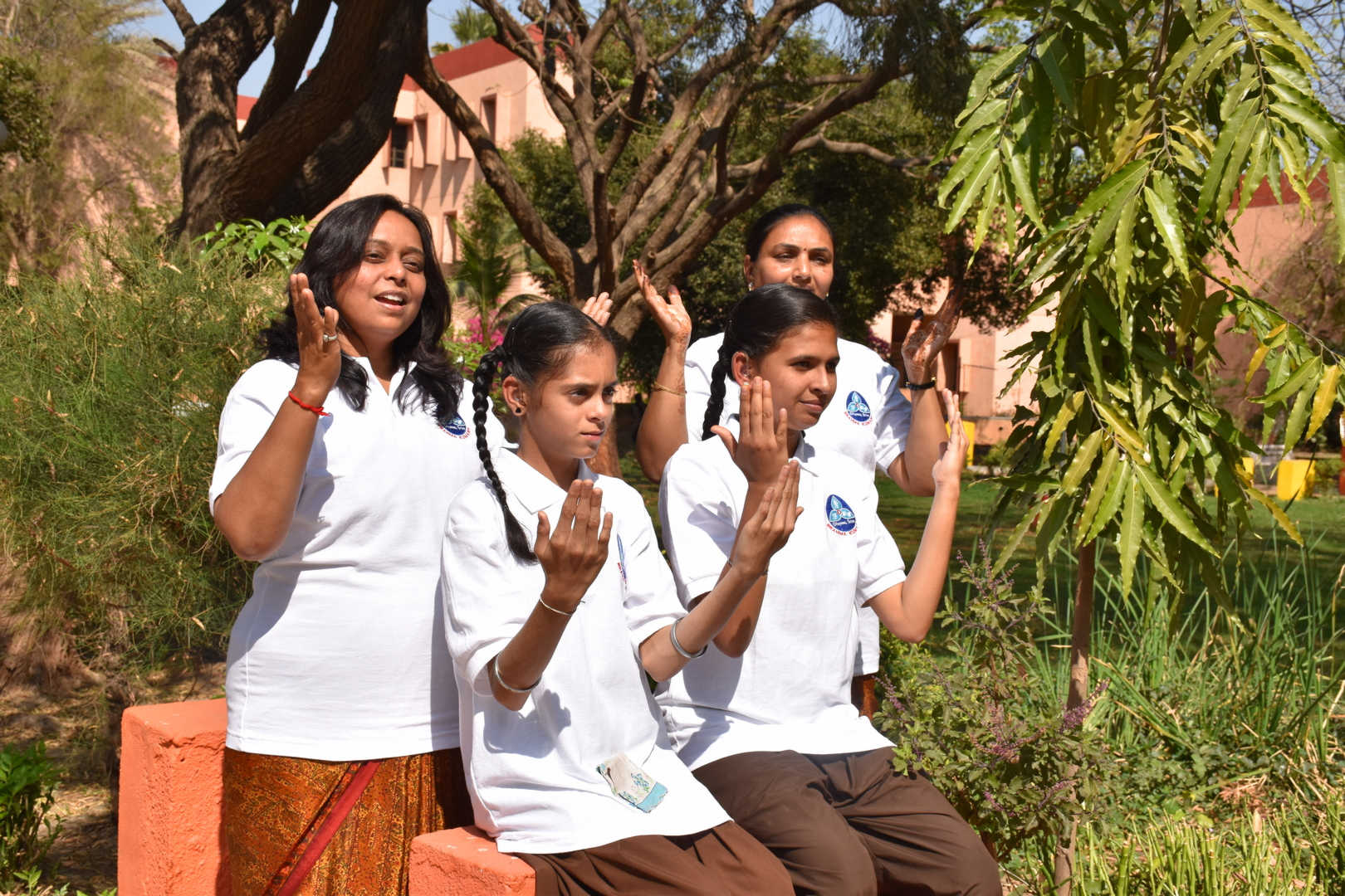 Girls performing video album inspirational songs in sign language